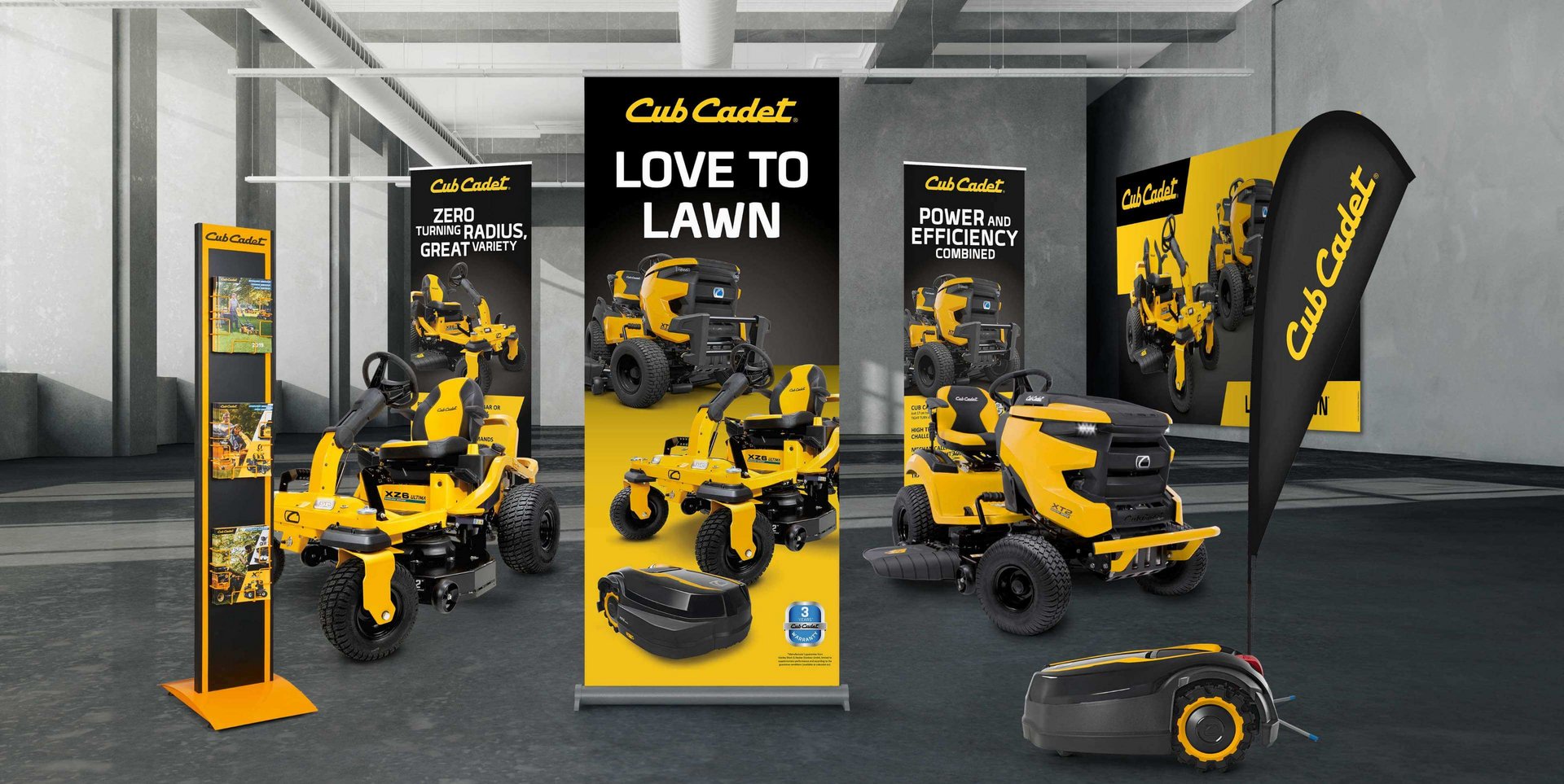 Markeninszenierung von Cub Cadet mit Maschinen, Bannern, Fahnen und Displays in Gelb-Schwarz.