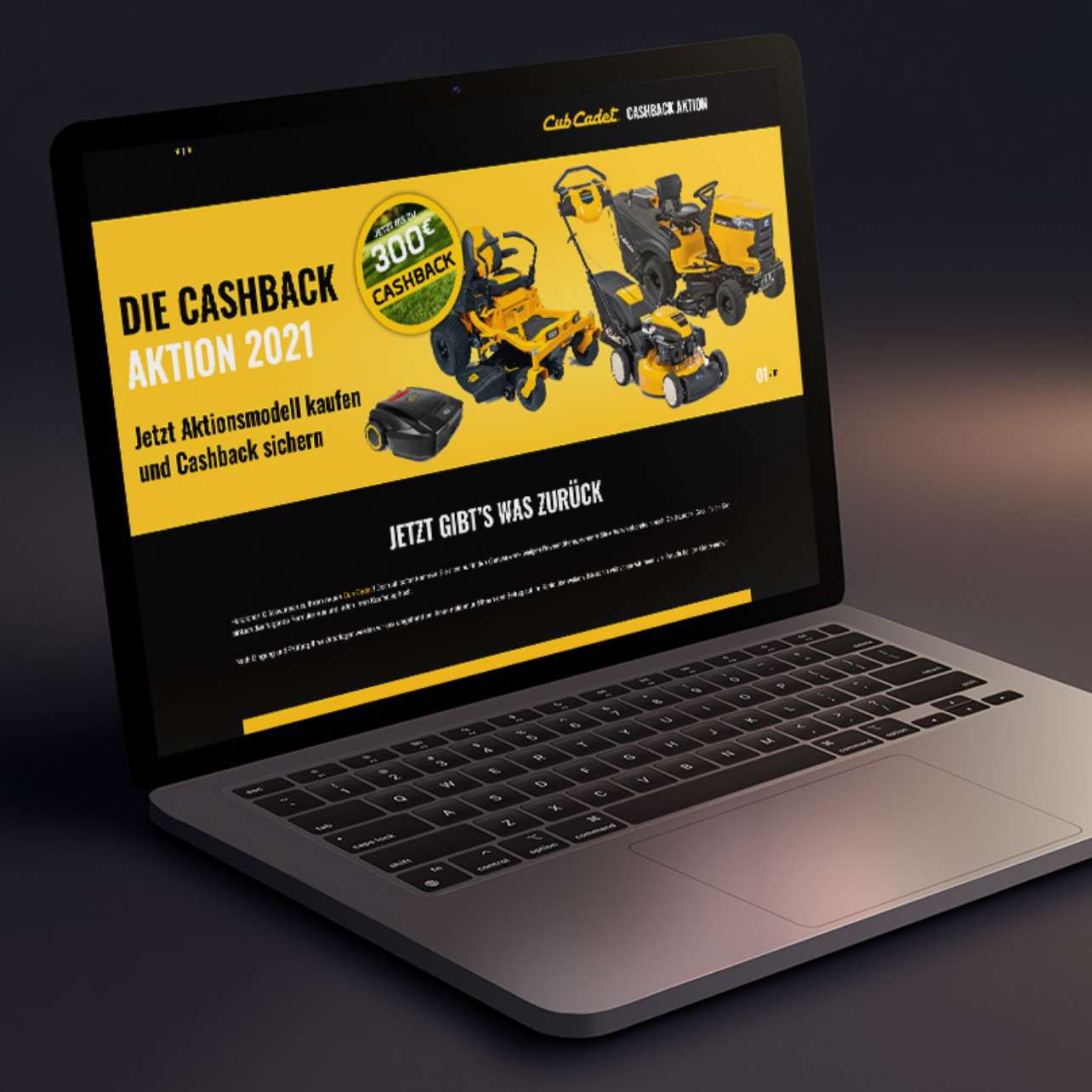 Mockup der Cub Cadet Website auf einem Laptop – kräftiges Gelb-Schwarz-Design mit Maschinenabbildung.